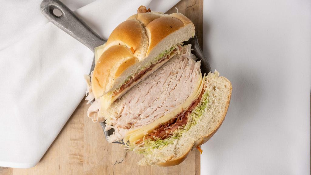 Turkey Club Sandwich · Turkey! Swiss, bacon, lettuce, tomato, ranch, or mayo.