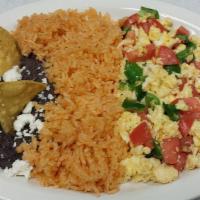Huevos A La Mexicana · Eggs Mexican style. Served with rice, beans and tortillas.