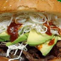 Bistec Cemita · Steak. Served with string cheese, avocado, onion, papalo, chipotle, beans and mayonnaise.