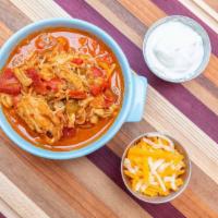Southwestern White Bean Chicken Chili · Shredded chicken with white beans and hatch green chilies built into a hearty stew. Served w...