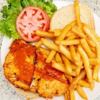 Spicy Chicken Sandwich · Spicy. Served on a bun in Buffalo sauce with lettuce, tomato, French fries, coleslaw, and pi...