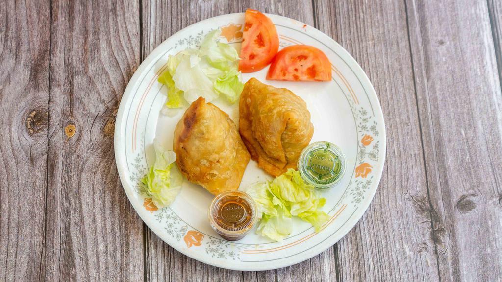 Vegetable Samosa · Seasoned potatoes and green peas wrapped in a crispy pastry.