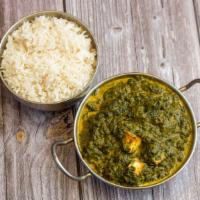 Palak Paneer · Homemade cheese simmered in creamy fresh spinach puree and garnished with chopped cilantro a...