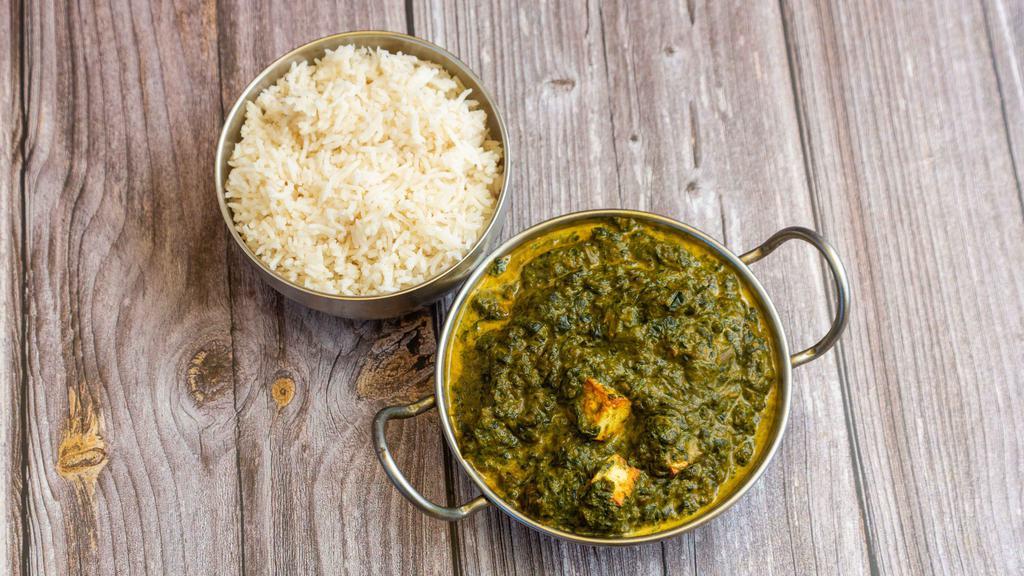Palak Paneer · Homemade cheese simmered in creamy fresh spinach puree and garnished with chopped cilantro and ginger.