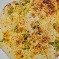 Garlic Naan · Leavened white flour bread brushed with fresh chopped garlic and cilantro.