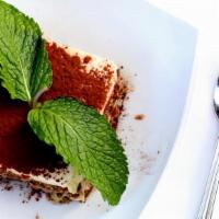 Tiramisu · Whipped mascarpone custard with layer of espresso sponge cake and chocolate sauce.