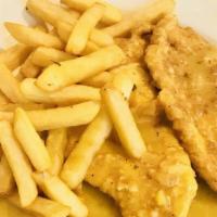 Chicken Francese · Chicken scallopini dipped in egg and sauteed in a lemon and butter sauce. Served with vegeta...
