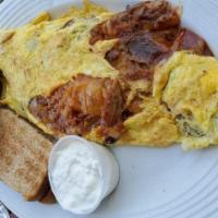 Bbq Pork Omelette · Shredded pork, Jack, and Cheddar cheese, topped with sour cream & pico de gallo