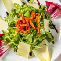 Family Insalata Di Arugula · Serves 5 to 6.  
Arugula, endive, radicchio, sun-dried tomatoes, honey vinaigrette, parmesan...