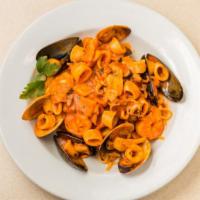 Linguine Del Pescatore · Linguine, calamari, scallops, shrimps, clams, fresh spicy tomato sauce.