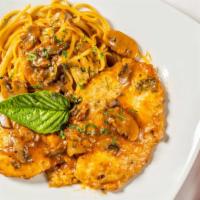 Pollo Con Marsala · Sautéed chicken breast, mushroom, marsala sauce with pasta.