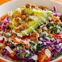Flower Power · Curly kale, shredded red cabbage and carrots, grape tomatoes and avocado, topped with crispy...