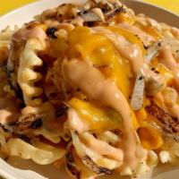 Animal Fries · Fries covered in melted v cheddar, grilled onions, mondo sauce. Gluten free.