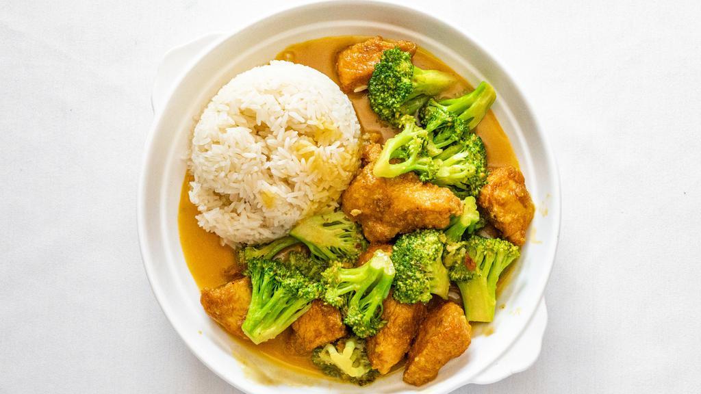 Chicken & Broccoli · Chicken & Broccoli topped with white sesame seeds, cooked in a garlic sauce served with white rice.