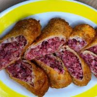 Reuben Rolls · Eggrolls filled with corned beef, sauerkraut & Swiss; served with a side of Russian dressing