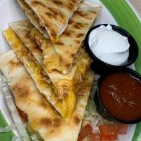Spicy Chicken Quesadilla · Served with lettuce, tomatoes, salsa & sour cream
Add a Side of Guacamole $3