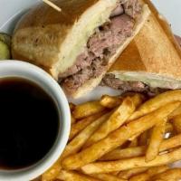 Prime Rib Dip · Sliced prime rib & melted Swiss on a long roll or a wrap & a side of au jus