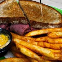 Corned Beef Sandwich · Piled high on buttered & grilled rye