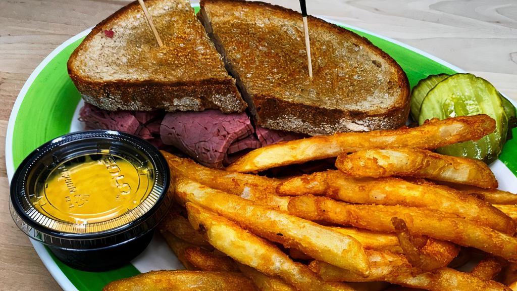 Corned Beef Sandwich · Piled high on buttered & grilled rye