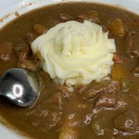 Guinness Beef Stew · Topped with mashed potatoes & served with a buttered Irish Scone
