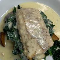 Shamrock Cod · Pan seared & topped with an Irish parsley cream sauce; served over sautéed spinach & roasted...