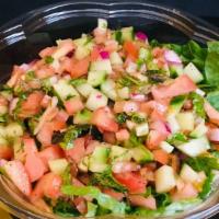 Israeli Salad · Mixed greens, chopped tomato, chopped cucumber, red onion, chopped mint leaf, fresh lemon ju...
