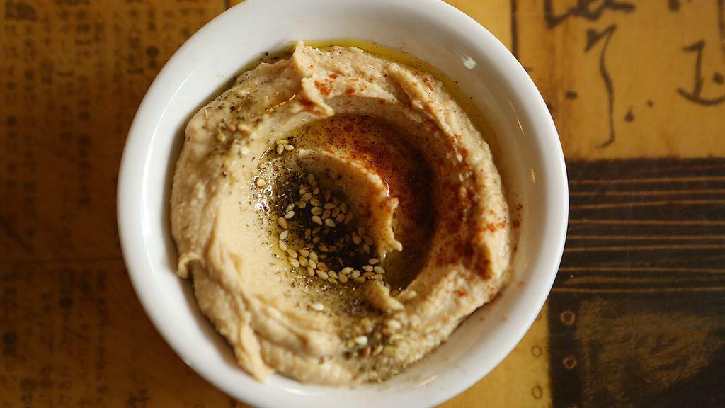 Hummus Plate & Za'Atar · Served with a small salad and a side of bread.