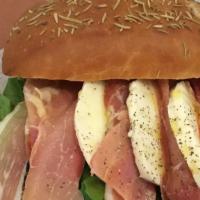 Prosciutto Sandwich · Mozzarella cheese, pesto and arugula. Made to order and can be press toasted on your choice ...