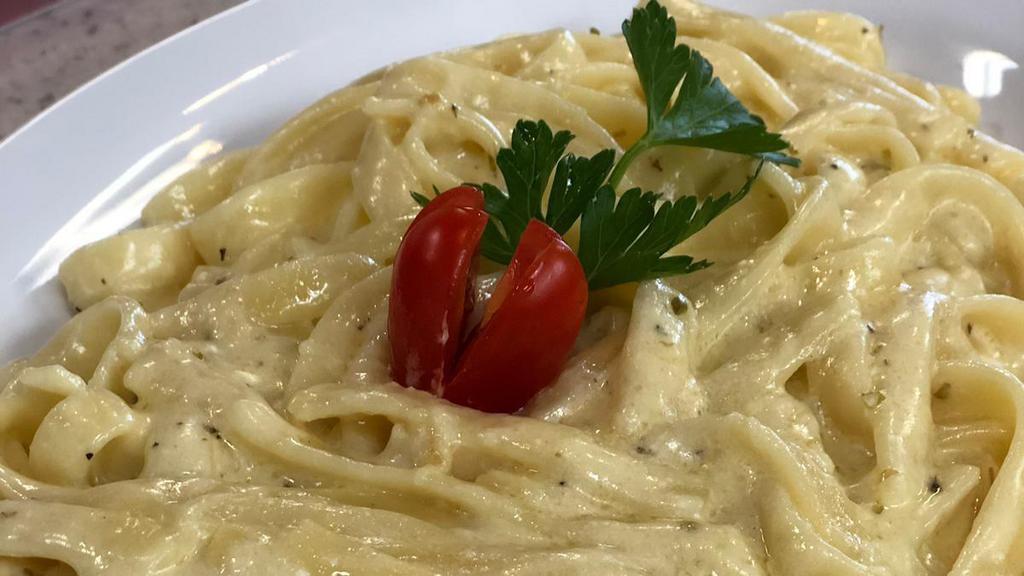 Fettuccini Alfredo Pasta · Personal Dish (kosher)  - Fettuccine Alfredo or fettuccine al burro is an Italian pasta dish of fresh fettuccine tossed with butter and Parmesan cheese. As the cheese melts, it emulsifies the liquids to form a smooth and rich sauce coating the pasta.