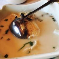 Tom Yum Gai · Spicy. Chicken, mushrooms, and onions seasoned with lime juice and lemon grass in a spicy ch...