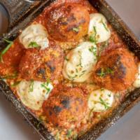 Meatballs · Warm herb and garlic ricotta, marinara, Parmesan.