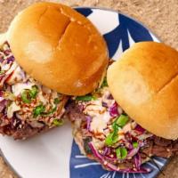 Two Bbq Beef Sliders · Slowly smoked hand-pulled BBQ beef doused in our homemade bbq sauce served in soft potato sl...