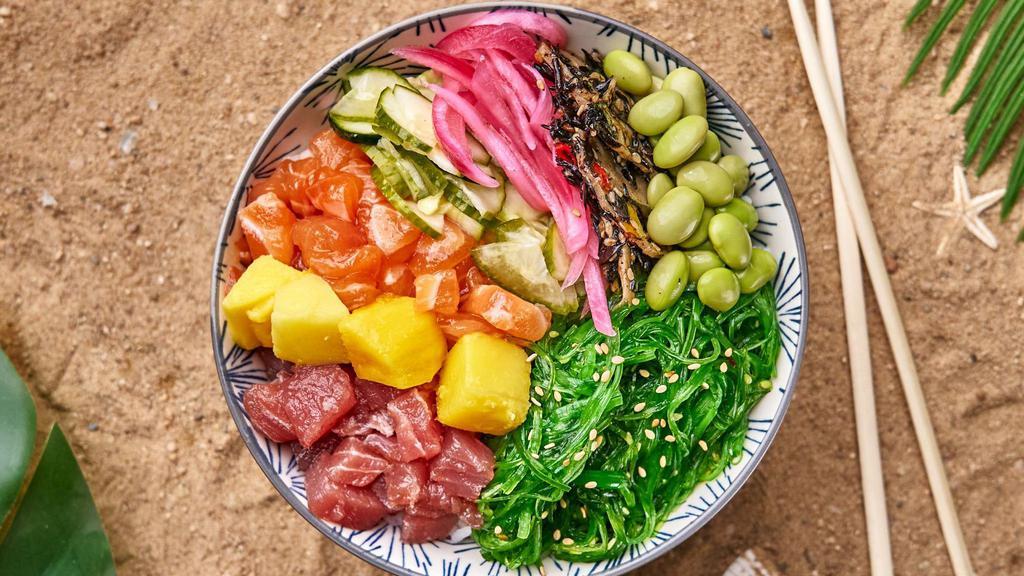 Gochujang Salmon & Tuna Bowl · Salmon and tuna with cucumbers, mango, edamame, masago, kani salad, jalapeno, and burnt onion crisps with gochujang sauce and your choice of base.