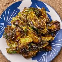 Fried Brussel Sprouts · Freshly fried baby brussel sprouts with a yuzu balsamic glaze.