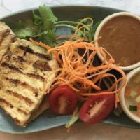 Chicken Satay (4) · Marinated grilled chicken served with sweet cucumber sauce and peanut sauce.