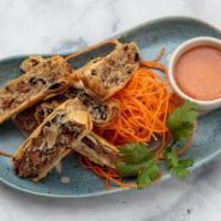 Duck Roll (3) · Fried roasted duck wrapped in spring roll skin served with sweet chili sauce.