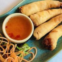 Crispy Shrimp Roll (5) · Fried marinated shrimp wrapped in spring roll skin served with sweet chili sauce.