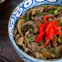 Gyu Don(牛肉饭) · Thinly sliced beef and onion, eggs, over rice.