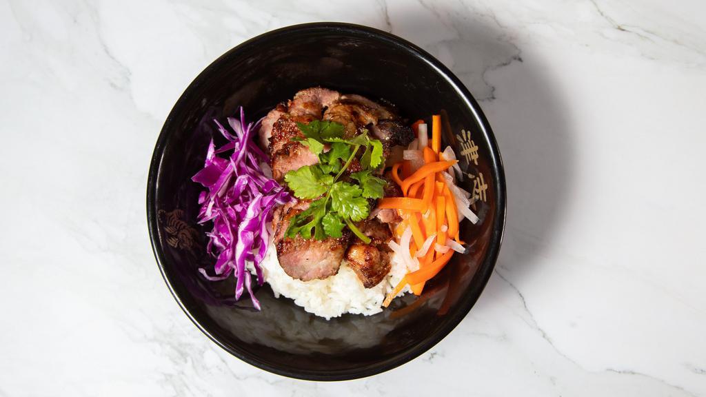 Rice Bowl (White Or Brown) · Choice of protein over jasmine rice with lettuce, pickled carrots, daikon and red cabbage, cucumber, a side of spicy sauce. Add fried egg for an additional charge.