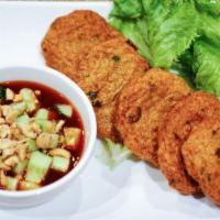 Thai Fish Cakes 泰式鱼饼 · Spicy. Deep fried homemade fish cakes with cucumber peanut achat.