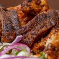 Bbq Combo Chicken And Pork Ribs · Comes with two sides.