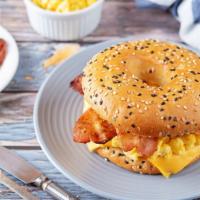 2 Eggs Sandwich With Bacon · Delicious Breakfast sandwich topped with 2 cooked eggs and crispy bacon. Served on customer'...