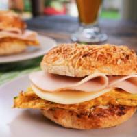 Ham & Cheese Omelette Sandwich · Delicious Breakfast sandwich topped with a cooked omelette, ham, and melted cheese. Served o...