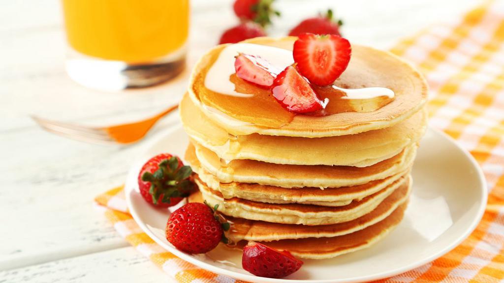 Strawberry Pancakes · 3 Buttery pancakes cooked to perfection and topped with fresh strawberries.