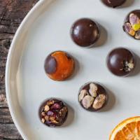 Fruit & Nut Clusters  (20 Pc) · Dairy free, spicy. Dark bittersweet chocolate, dairy-free and vegan. Includes: apricot (brig...