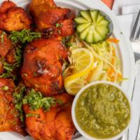 Chicken Tikka · Boneless chicken marinated in tandoori spices and cooked in our clay oven