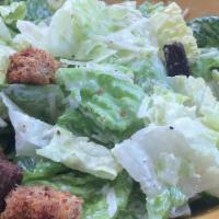 Caesar Salad · Chopped romaine lettuce, tomatoes, Parmesan cheese and chipotle croutons.