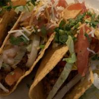 Tacos De Pollo · Three pieces.