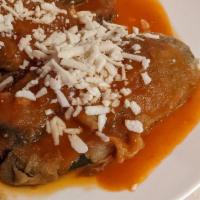 Chiles Rellenos · Stuffed poblano peppers with chicken and cheese served with pico de gallo, rice, beans and c...
