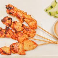 Satay (4 Pc) · Choice of protein skewers marinated, satayed, and served with a peanut dipping sauce and cuc...